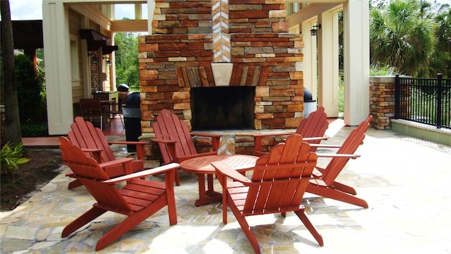 view of patio / terrace with an outdoor stone fireplace