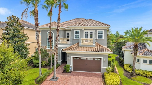 mediterranean / spanish-style home featuring a garage