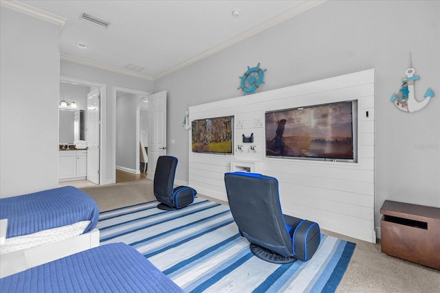 bedroom with light carpet, crown molding, and ensuite bath