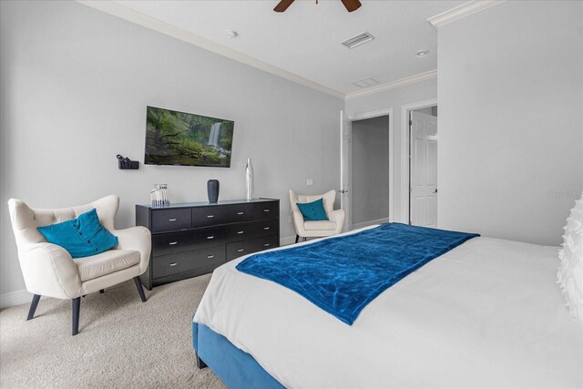 bedroom featuring crown molding, ceiling fan, and carpet