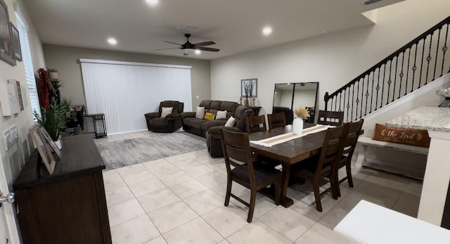 dining room with light tile patterned flooring and ceiling fan