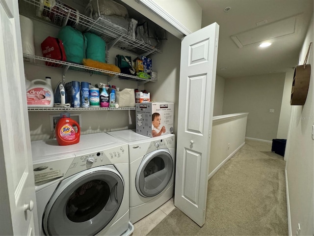 laundry room with light carpet and washer and dryer