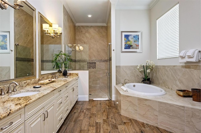 bathroom with hardwood / wood-style floors, vanity, crown molding, and independent shower and bath