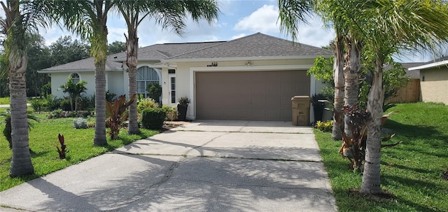 ranch-style house featuring a garage and a front yard