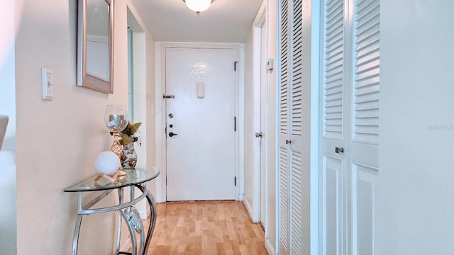 entryway with light hardwood / wood-style flooring