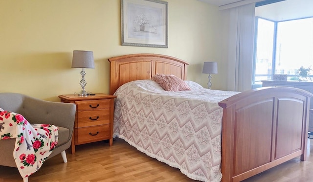 bedroom with light hardwood / wood-style floors