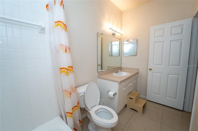 full bathroom featuring shower / bath combo with shower curtain, tile patterned flooring, vanity, and toilet