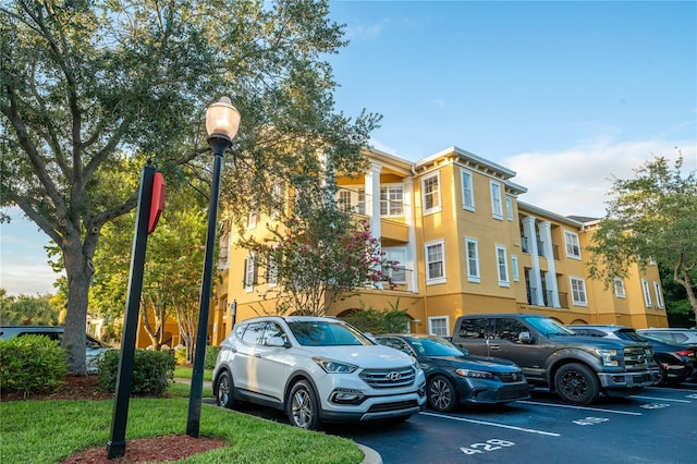 3593 Conroy Rd Unit 437, Orlando, FL 32839 - view of property featuring uncovered parking