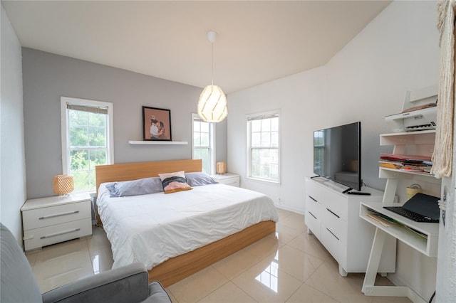 bedroom featuring multiple windows and light tile patterned floors