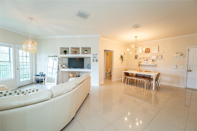 tiled living room with crown molding and a chandelier