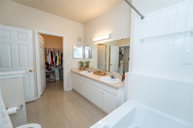 3593 Conroy Rd Unit 437, Orlando, FL 32839 - full bath featuring tile patterned floors, a tub to relax in, double vanity, and a spacious closet