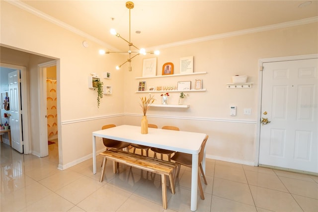 dining room featuring a notable chandelier, crown molding, and light tile patterned flooring