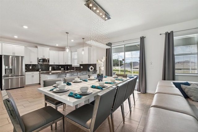 dining space with a chandelier