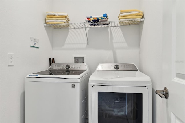 washroom featuring independent washer and dryer