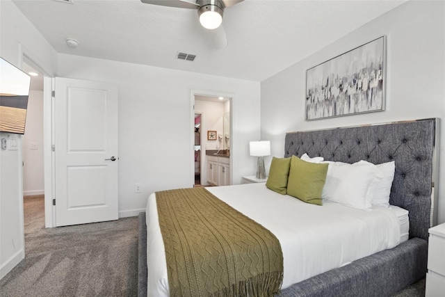 bedroom with carpet, ensuite bath, and ceiling fan