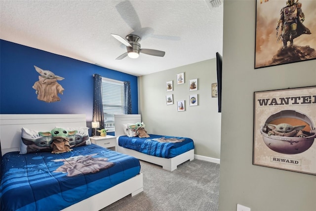 bedroom with carpet, ceiling fan, and a textured ceiling