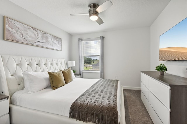 bedroom featuring dark colored carpet and ceiling fan