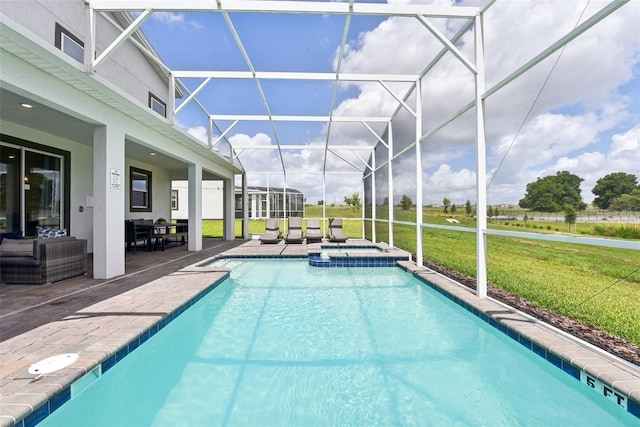 view of pool featuring a lawn, glass enclosure, an in ground hot tub, and a patio