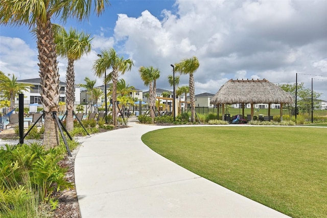 view of property's community with a gazebo and a lawn