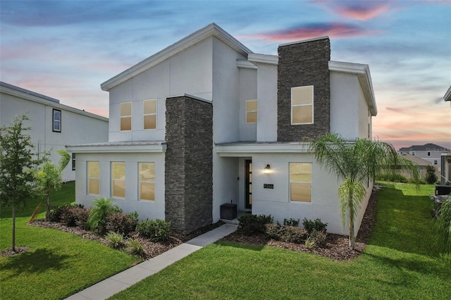 contemporary house featuring a lawn