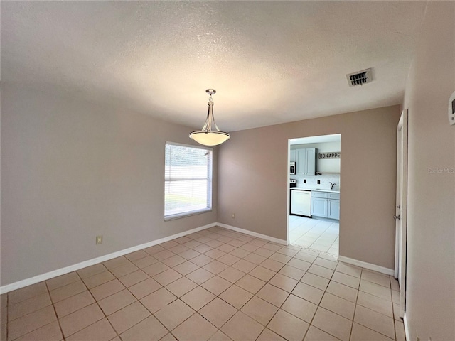 tiled empty room with sink