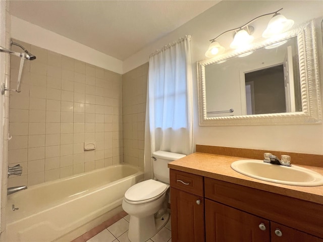 full bathroom featuring tile patterned floors, vanity, tiled shower / bath combo, and toilet