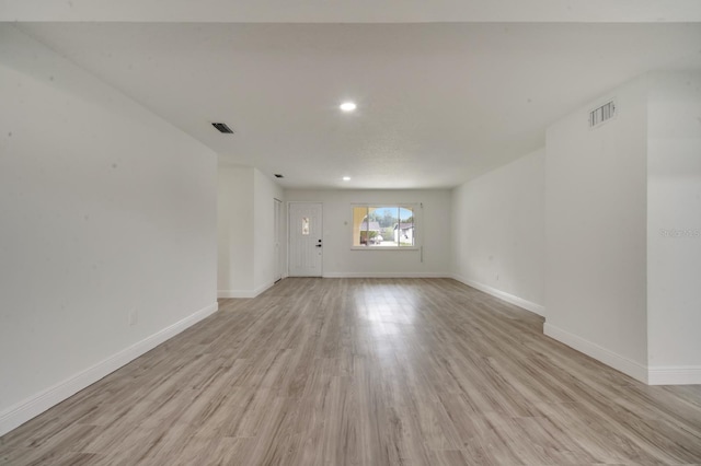 empty room with light wood-type flooring