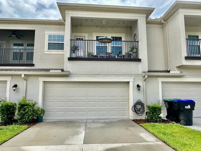 multi unit property featuring a garage and a balcony