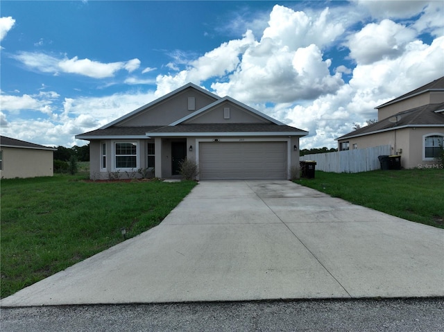 view of front of house featuring a garage and a front yard