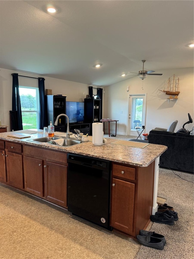 kitchen with an island with sink, a healthy amount of sunlight, black dishwasher, and sink