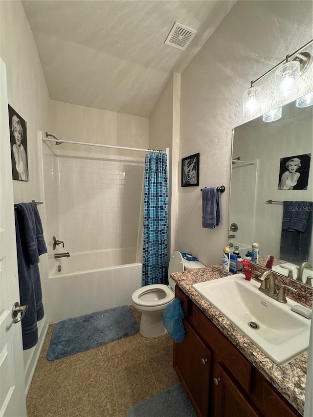 full bathroom featuring shower / bathtub combination with curtain, tile patterned flooring, vanity, vaulted ceiling, and toilet