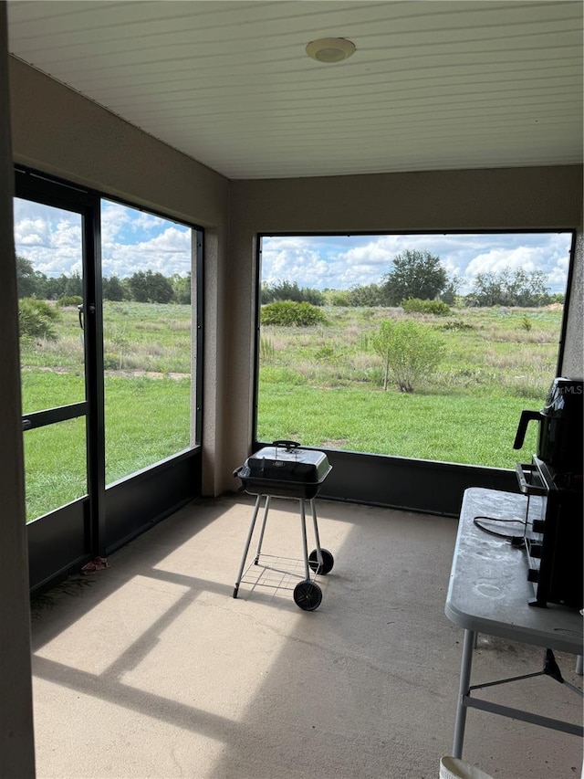 sunroom / solarium with a rural view