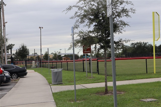 view of property's community with a yard