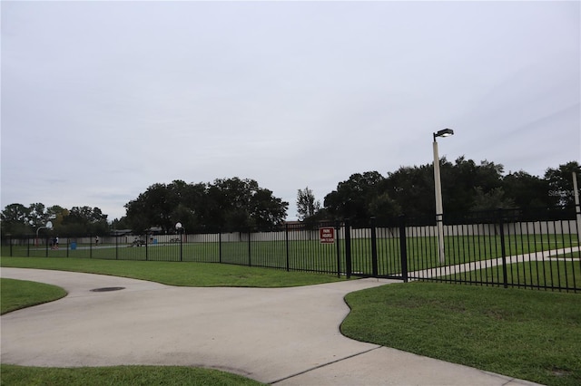 view of property's community featuring a lawn