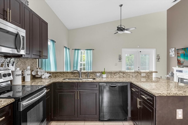 kitchen featuring kitchen peninsula, appliances with stainless steel finishes, ceiling fan, a healthy amount of sunlight, and sink