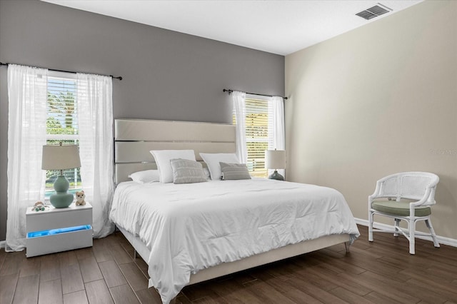 bedroom featuring dark wood-type flooring