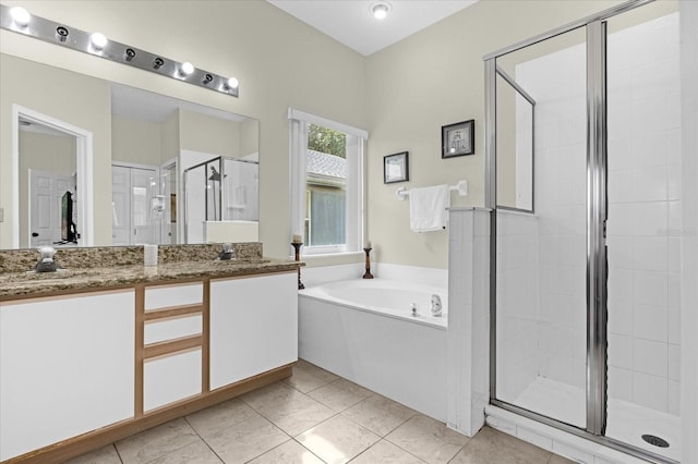 bathroom with tile patterned floors, vanity, and independent shower and bath