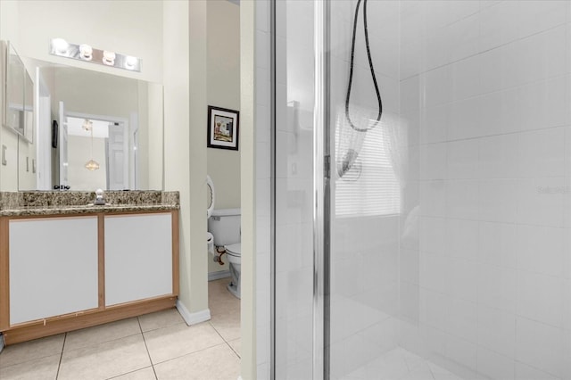 bathroom with tile patterned floors, vanity, toilet, and walk in shower