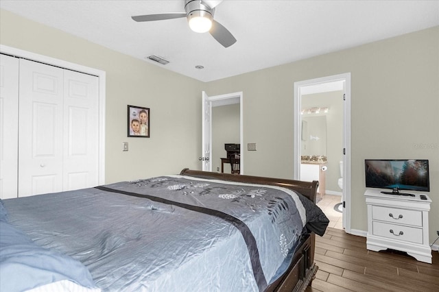 bedroom featuring ceiling fan, connected bathroom, and a closet