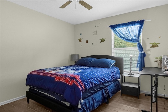 bedroom with hardwood / wood-style floors and ceiling fan