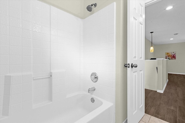 bathroom featuring shower / tub combination and hardwood / wood-style floors