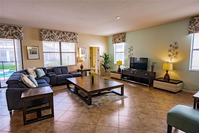 living room featuring tile patterned floors and plenty of natural light