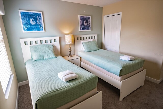 carpeted bedroom with a closet