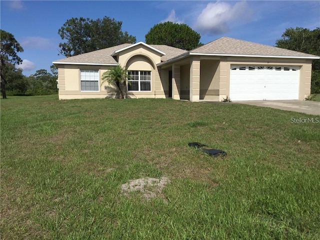 ranch-style home featuring a garage and a front lawn