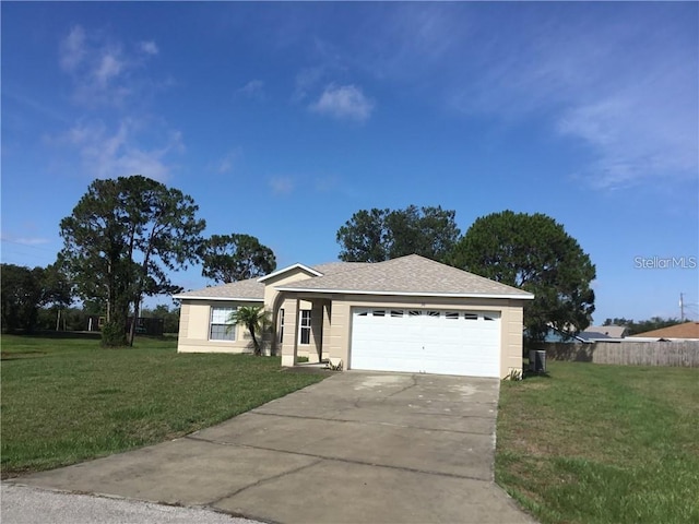 ranch-style house with a garage and a front lawn