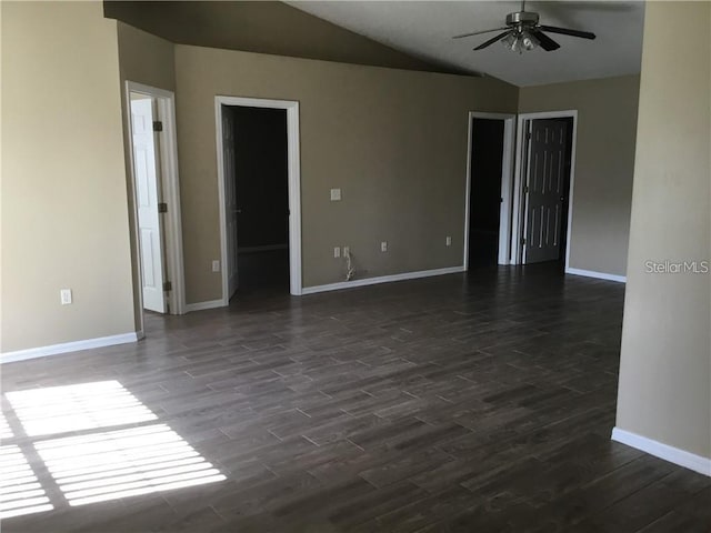 unfurnished room with ceiling fan, lofted ceiling, and dark hardwood / wood-style floors