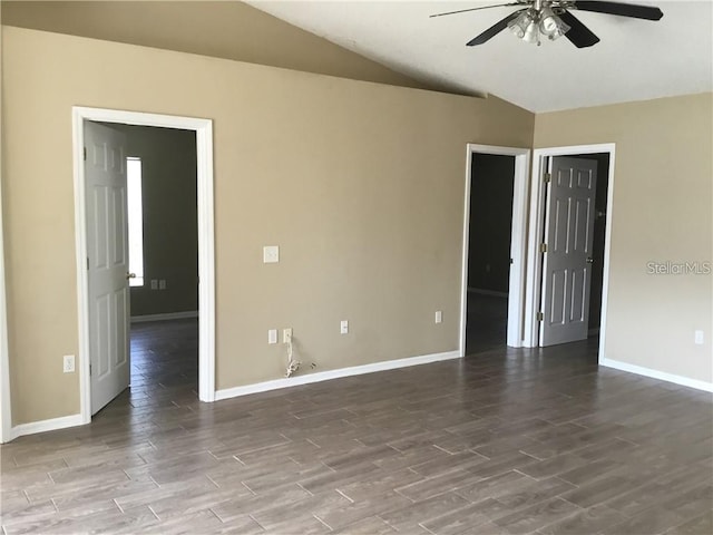 spare room featuring lofted ceiling, hardwood / wood-style floors, and ceiling fan