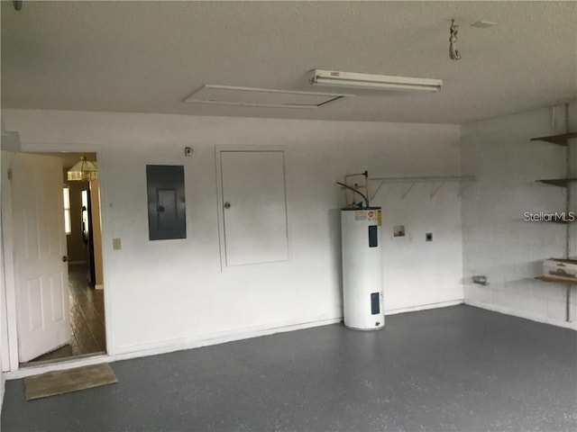 garage featuring electric water heater and electric panel