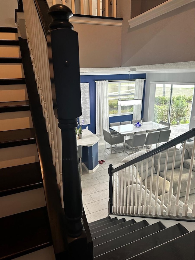 stairs with tile patterned floors and plenty of natural light