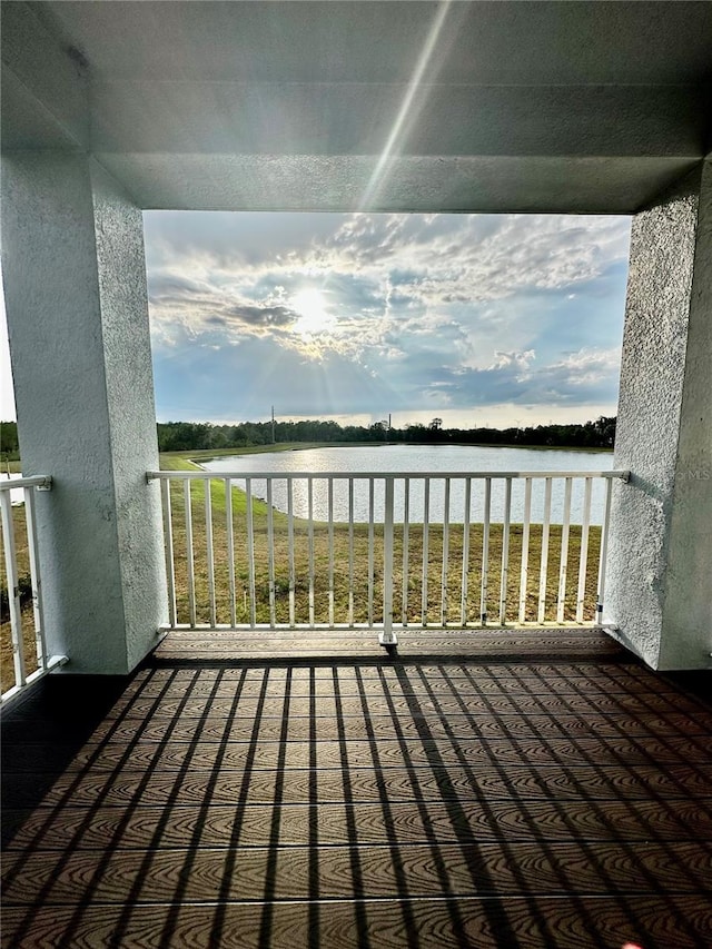 wooden deck with a water view